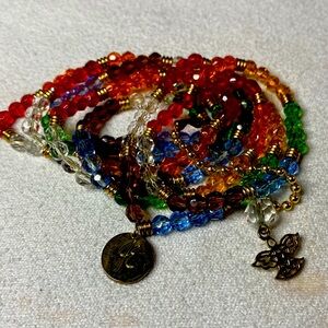 Seven stretch rainbow bracelets. Great to stack. With multitudes of colors.